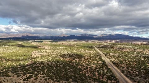 Cinematic Drone Hyperlapse Flying Toward Stormy Mountains with Silhouetted Видео 334196709