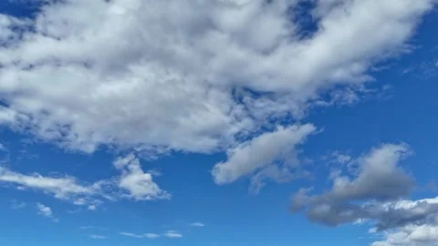 Cinematic drone hyperlapse of large clouds drifting across the sky 库存影片 317911828