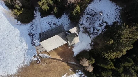 Cinematic Drone Orbit Around Remote Alpine Chapel on Snowy Mountain Peak Stock Footage 331802078