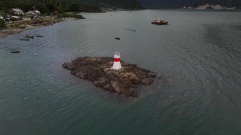 Cinematic Drone Orbit Around Remote Lighthouse on Rocky Island in Chile Video stock 333123569