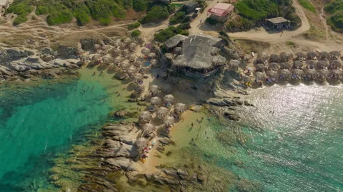 Cinematic drone orbit around a vibrant island cove Stock Footage 263157134