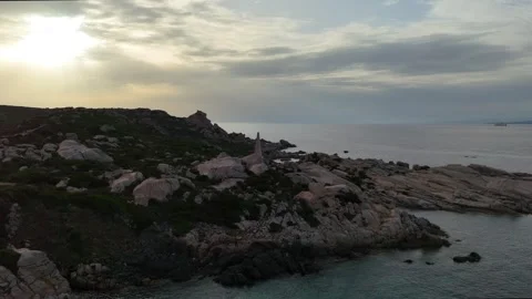 Cinematic Drone Orbit Lighthouse at Golden Hour Sardegna Mediterranean C Vídeo Stock 333400053