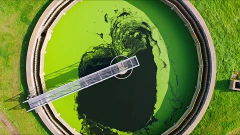 Cinematic Drone Orbit Rising Over Green Water Tank in Liepaja Latvia Stockbeeldmateriaal 333816936