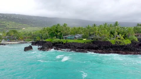 Cinematic Drone Orbit of  Rugged Volcanic Beach and Turquoise Ocean, Big Island Stock Footage 328388015