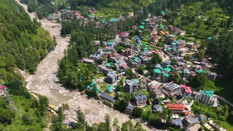 Cinematic drone Orbit shot of Parvati River Valley with Kasol town and lush.. Stock Footage 345274810