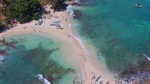 Cinematic drone pan around the iconic Blue Beach in Hiriketiya Sri Lanka Stock Footage 331027405