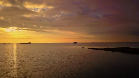 Cinematic drone panning past old fisherman cabin in tranquil wetlands Stock Footage 345978491