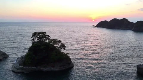 Cinematic Drone Pull Away from Island at Sunset Dogashima Stock Footage 326081778