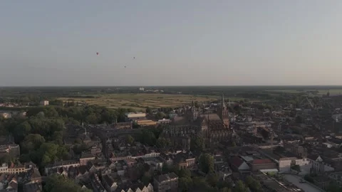 Cinematic Drone Pull-Back Revealing Historic European Cathedral at Sunset Stock Footage 327560103