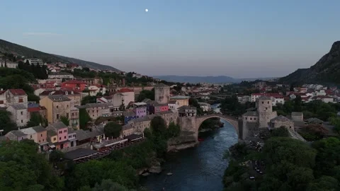 Cinematic Drone Pull Back of Stari Most Bridge and Mostar Mosque Under Moon 4K Stock Footage 337831280