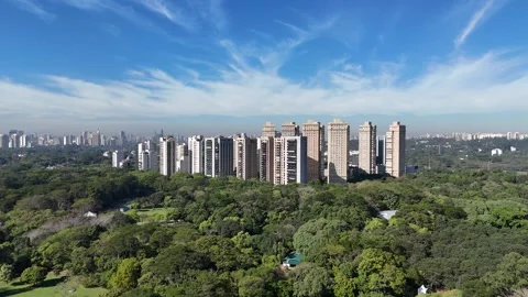Cinematic drone pullback from luxury residential towers near Villa-Lobos Park Vídeo Stock 339101609