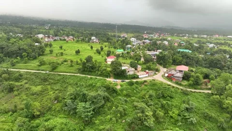 Cinematic drone pullback over verdant terraced step farming fields Video stock 345279001