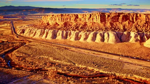 Cinematic drone pullback from red rock plateau showcasing a glowing Video stock 333848093