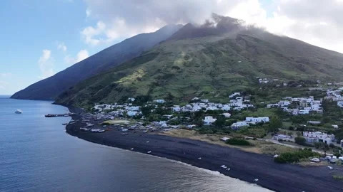 Cinematic Drone Pullback of Stromboli Island Village and Volcano Stock Footage 305264022