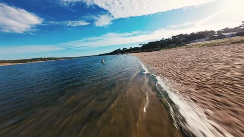 Cinematic drone shot captures tranquil bay with gentle waves Stock Footage 340905001
