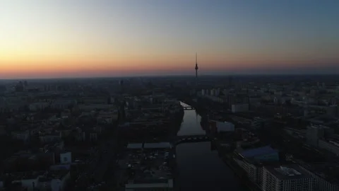 Cinematic Drone Shot Flying fast Backwards Over Berlin at Sunset 09/17/2024 Stock Footage 328781013