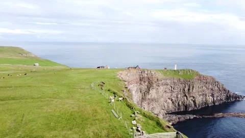 Cinematic drone shot of the iconic white Akraberg Lighthouse Stock Footage 340169225