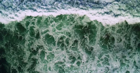 Cinematic Drone Shot of Ocean Waves Creating Natural Coastal Motion 스톡 동영상 330585442