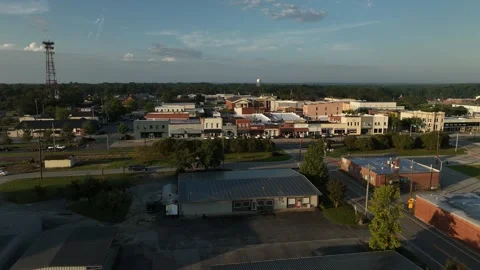 A Cinematic Drone Shot over Small Georgia Town during Sunrise Stock Footage 331047639