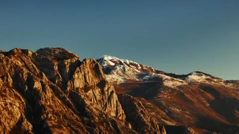Cinematic drone shot when sunlight illuminates Lovcen mountain in Montenegro Stock Footage 313733449
