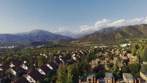 Cinematic drone sweep over a upscale neighborhood in San Carlos de Apoquindo Stock Footage 332568475