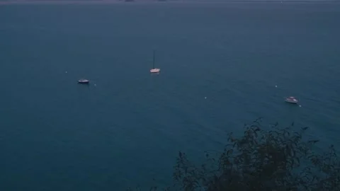 Cinematic drone tilt down sunset horizon Mont Saint-Michel abbey France distant Stock Footage 337511092