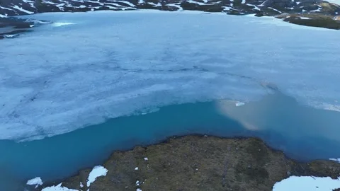 Cinematic Drone Tilt Over Mountain Stream and Glacial Lake in Norway Stock Footage 313446637