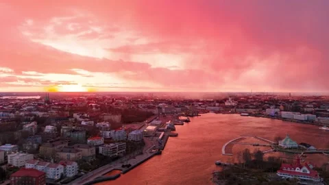 Cinematic drone timelapse of storm clouds and glowing pink sky in Finland 스톡 동영상 336703937