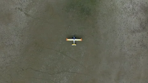 Cinematic Drone Top Down Plane Taking Off Front Stock Footage 251825800