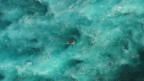 Cinematic Drone Tracking Shot Surfer Floating Uluwatu Coast 4K Vidéo 341005232