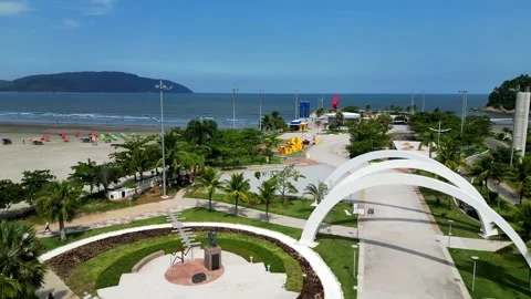 Cinematic drone video of a public park surrounded by nature on the beach. Video stock 240793653