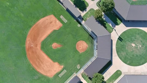 Cinematic drone view descending clockwise between home plate and pitcher mound Stock Footage 205035326