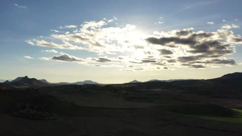 Cinematic Drone View of Dramatic Cloudscape Over Highland Plains in Middle Stock Footage 335917004