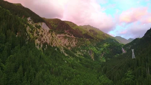 Cinematic drone view of green mountain valley at sunset light Stock Footage 318619088
