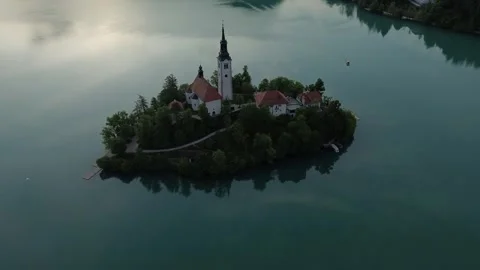 Cinematic drone view of iconic Bled Island and church, Slovenia Stock Footage 339173353