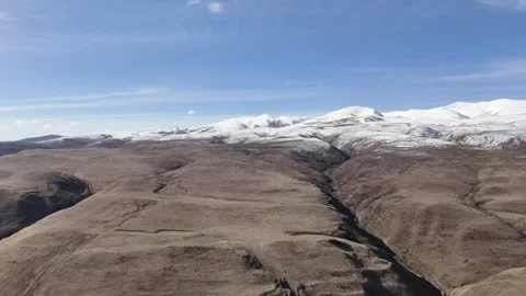 Cinematic drone view of mountain road and arid highland in China Stock Footage 337894402