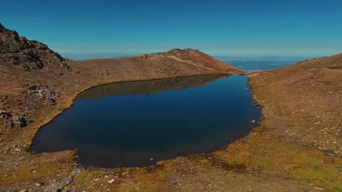 Cinematic Drone View Over Mountain Ridge at Sunrise. small lakes Video stock 318426596