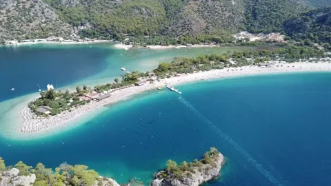 Cinematic Drone View Over Sandy Beach and Clear Blue Sea Video stock 310255338