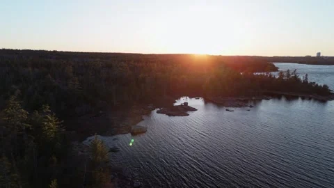 Cinematic drone view of a wild forest and lake Long Lake with a beautiful sunset Stock Footage 274367000