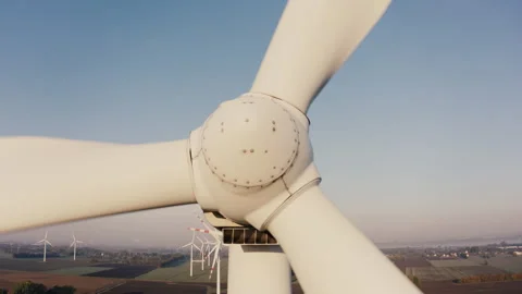 Cinematic drone view of a wind farm during sunrise in the countryside. Stock Footage 267926814