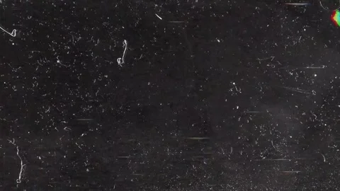 Cinematic Dust and Scratch Overlay on Black Background with Subtle Motion Stock Footage 327968935