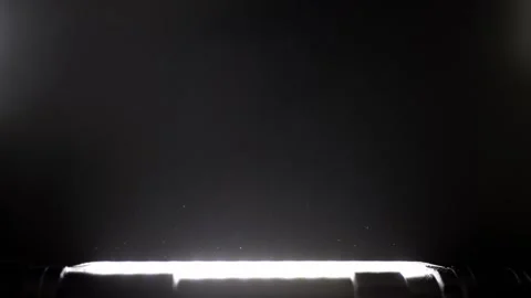Cinematic Dust Particles Floating in a Beam of Light Video stock 327646432
