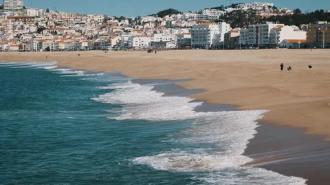 Cinematic empty sand beach, few people family walking around enjoying sunny day Stock Footage 273795181