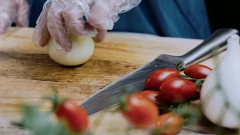 Cinematic fine dining angle: cutting beef into pieces for stewing Stock Photos