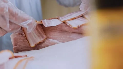 Cinematic finished dish: rolling pork tenderloin into a compact roast Stock Footage 342184664