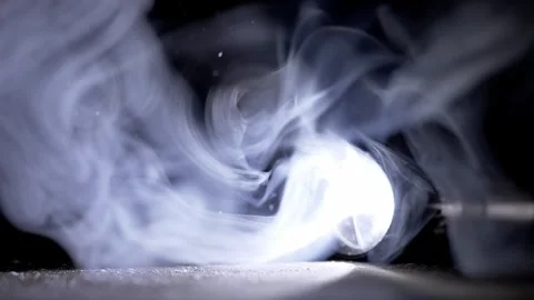 Cinematic Flashlight Beam Illuminating Swirling White Smoke In Dark Stock Footage 330115514