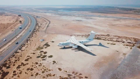 Cinematic flight around an old plane in the Emirates. 4K aerial video Stock Footage 90017594