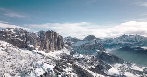 Cinematic flight in front of big mountains in winter 5k Stock Footage 221905689