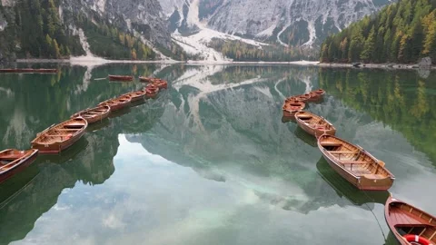 A cinematic flight over a beautiful alpine lake surrounded by mountains Stock Footage 257466834