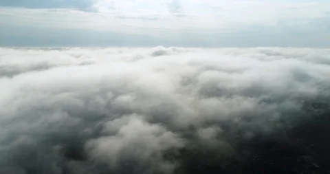 Cinematic flight over nice clouds in 4k. Video stock 100796473